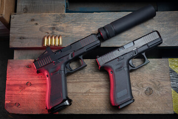 Firearms, silenced pistol, two 9mm pistols.