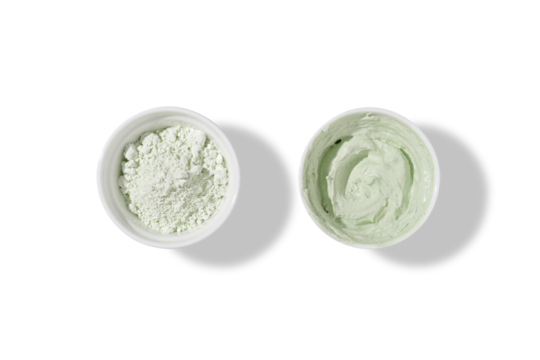 White bowls with green cosmetic clay on transparent background - mineral powder, bentonite facial mask. Skincare beauty concept. 