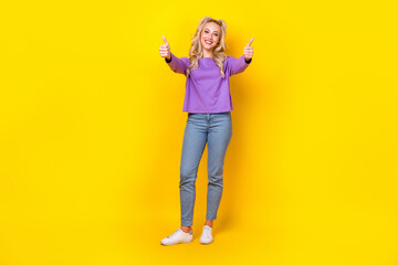 Fototapeta na wymiar Full length photo of lovely young lady hands shopping double thumb up dressed stylish violet garment isolated on yellow color background