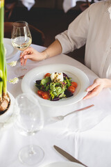 Green vegan salad with mixed green leaves and vegetables