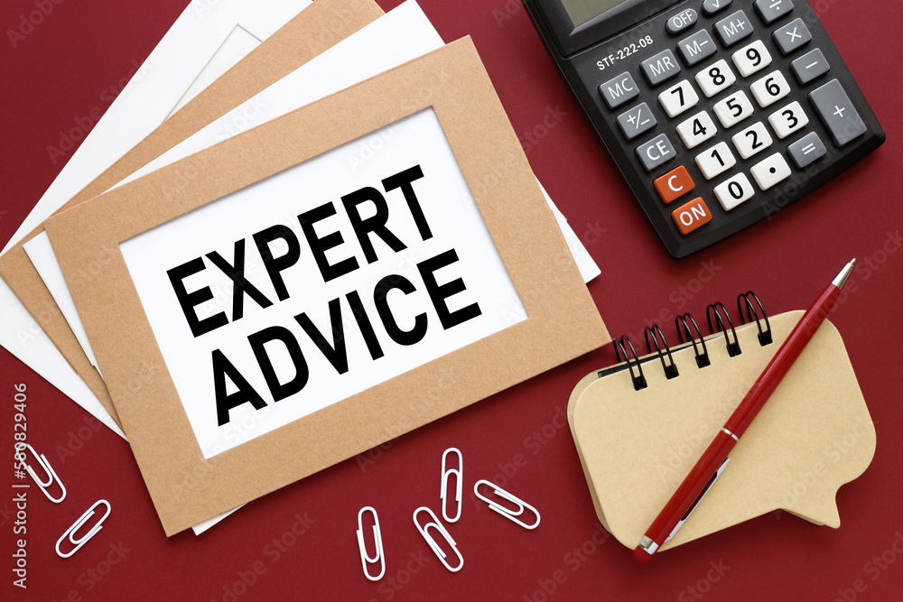 Aufkleber red background with notepad and calculator. text on white paper. expert advice