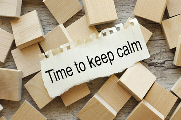 Time to Keep Calm. text on torn paper on wooden cubes.