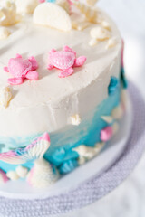 Fototapeta na wymiar Mermaid themed 3 layer vanilla cake