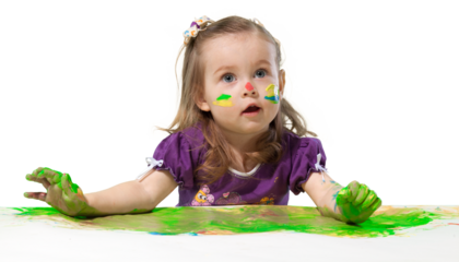 Young girl finger painting