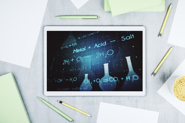 Modern digital tablet monitor with creative chemistry illustration, research and development concept. Top view. 3D Rendering