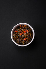 Delicious marinated seaweed with paprika, spices and salt
