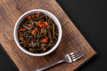 Delicious marinated seaweed with paprika, spices and salt