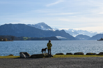 person on the lake with cute dog
