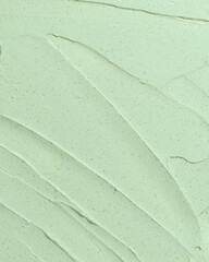 Beauty cream texture. Green cosmetic mask background. Creamy skincare product closeup