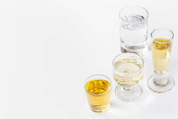 Alcohol in glasses with ice. Strong alcoholic drinks background