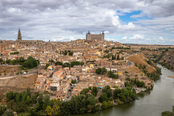 Fototapeta na wymiar Beautiful Panoramic of the city of Toledo from a viewpoint across the river on a Summer afternoon
