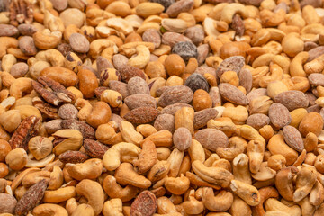 A group of almonds, pistachios, walnuts, macadamia, cashews.