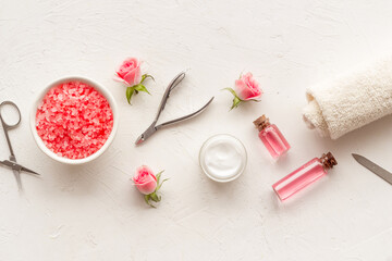 Professional manicure tools with pink roses flowers. Beauty care salon spa.