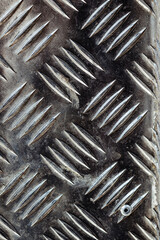 Diamond plate texture, background iron sheets with grooved notches, exterior floor covering in metal with engraved print, pattern style of steel floor for background,