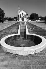 Decorative water pools and historic church in Abano Terme