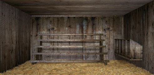 empty chicken coop from old wood lined with hay