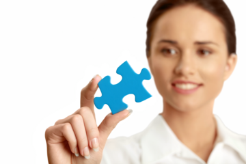 Female holding a puzzle piece