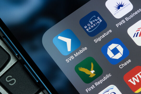 Portland, OR, USA - Mar 13, 2023: SVB, Signature Bank, PacWest, and First Republic Bank mobile apps are seen among other banking apps on an iPhone. Ripple effect of the Silicon Valley Bank collapse.