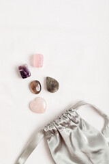 Crystals kit for calming and relaxation. Amethyst, roze and smoky quartz, labradorite gemstones for healing anxiety gift idea. Flat lay, top view mockup
