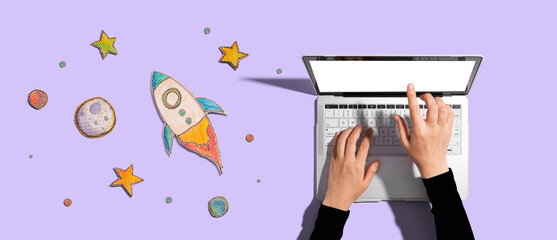 Space exploration theme with a rocket and a laptop