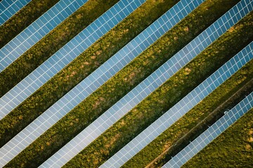 Solar panel rows aerial view. Photovoltaic panels farm from the sky, diagonal rows for renewable solar energy. Reducing  carbon footprint concept, clean green energy for the future.