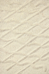Fototapeta na wymiar stylish beautiful pattern on the sand of the sea in the summer on the nature