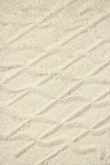 stylish beautiful pattern on the sand of the sea in the summer on the nature