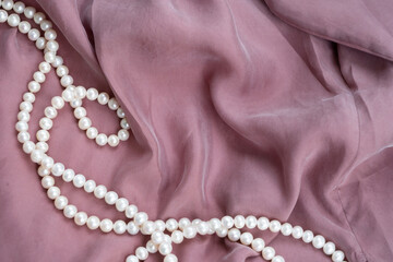 silk and pearls background styled stock scene, for wedding invitation, product showcase or styled presentation with copy space, top view