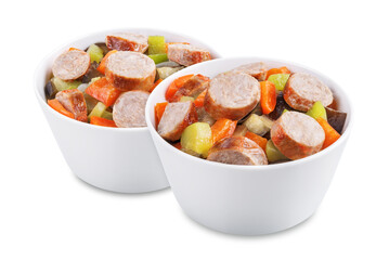 Italian sausages with prepared vegetables on a white isolated background