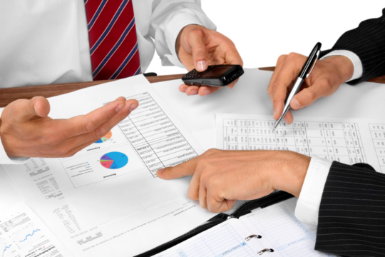 Business people making report isolated on white