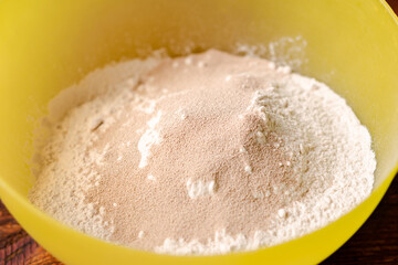 Flour and dry yeast. Preparation for preparation of dough for bread or pizza. Stirring fast-acting...