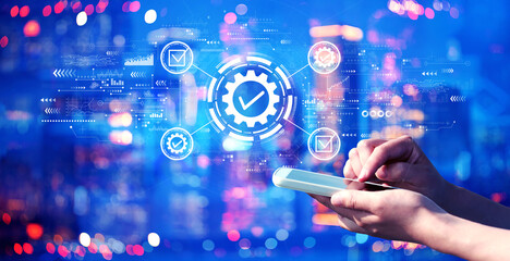 Quality control approval with person using a smartphone in a city at night