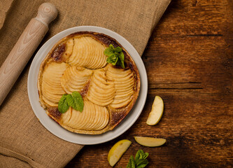 French apple pie on wooden background. Top vii.