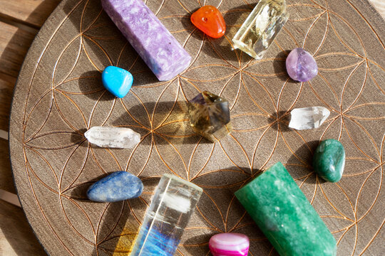 Gemstones minerals over life flower chart with sinshine. Magic healing Rock for Reiki Crystal Ritual, Witchcraft, spiritual esoteric practice
