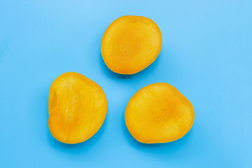 Tropical fruit, Mango on blue background. Top view