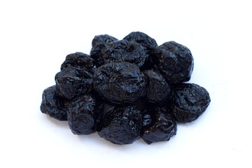Dried prunes on white background