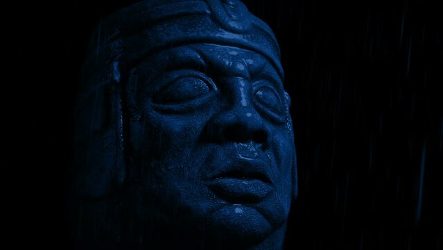 Ancient Statue Head In The Rain At Night