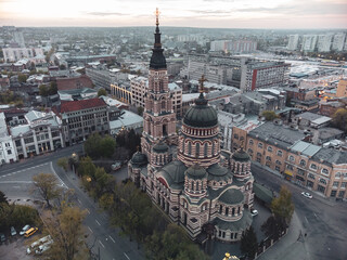 Fototapeta premium Holy Annunciation Cathedral aerial view with evening cloudscape. Kharkiv city orthodox church in downtown, Ukraine