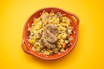 Traditional chickpeas dish in casserole in brown dish