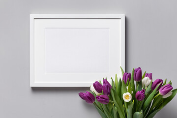 Landscape white frame mockup with fresh tulips flowers bouquet, blank mock up with copy space