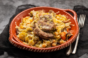 Traditional chickpeas dish in casserole in brown dish