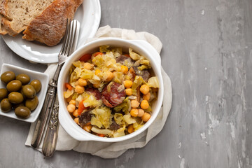 Traditional chickpeas dish in casserole in white bowl
