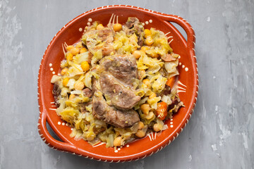Traditional chickpeas dish in casserole in brown dish