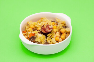 Traditional chickpeas dish in casserole in white bowl