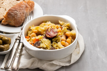 Traditional chickpeas dish in casserole in white bowl