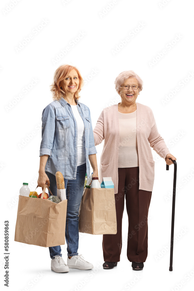 Wall mural Elderly mother and daughter posing with grocery bags