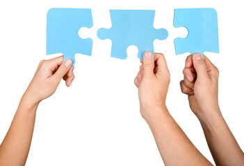 Closeup on Hands Combining Puzzle Pieces Together