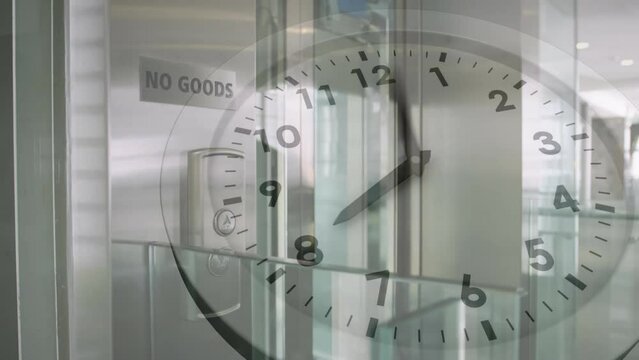 Animation of ticking clock against elevator going down at modern office