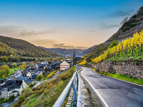 Valwig Village during sunset and bright coloured vineyards on Mocelle river in Cochem-Zell district, Germany