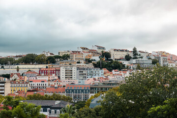 Fototapeta na wymiar Aerial panoramic view of Lisbon, Portugal. Drone photo of the Lisbon old town skyline. Historical district at sunrise in capital city of Portugal